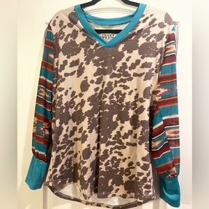 Women’s cowhide/Aztec blouse